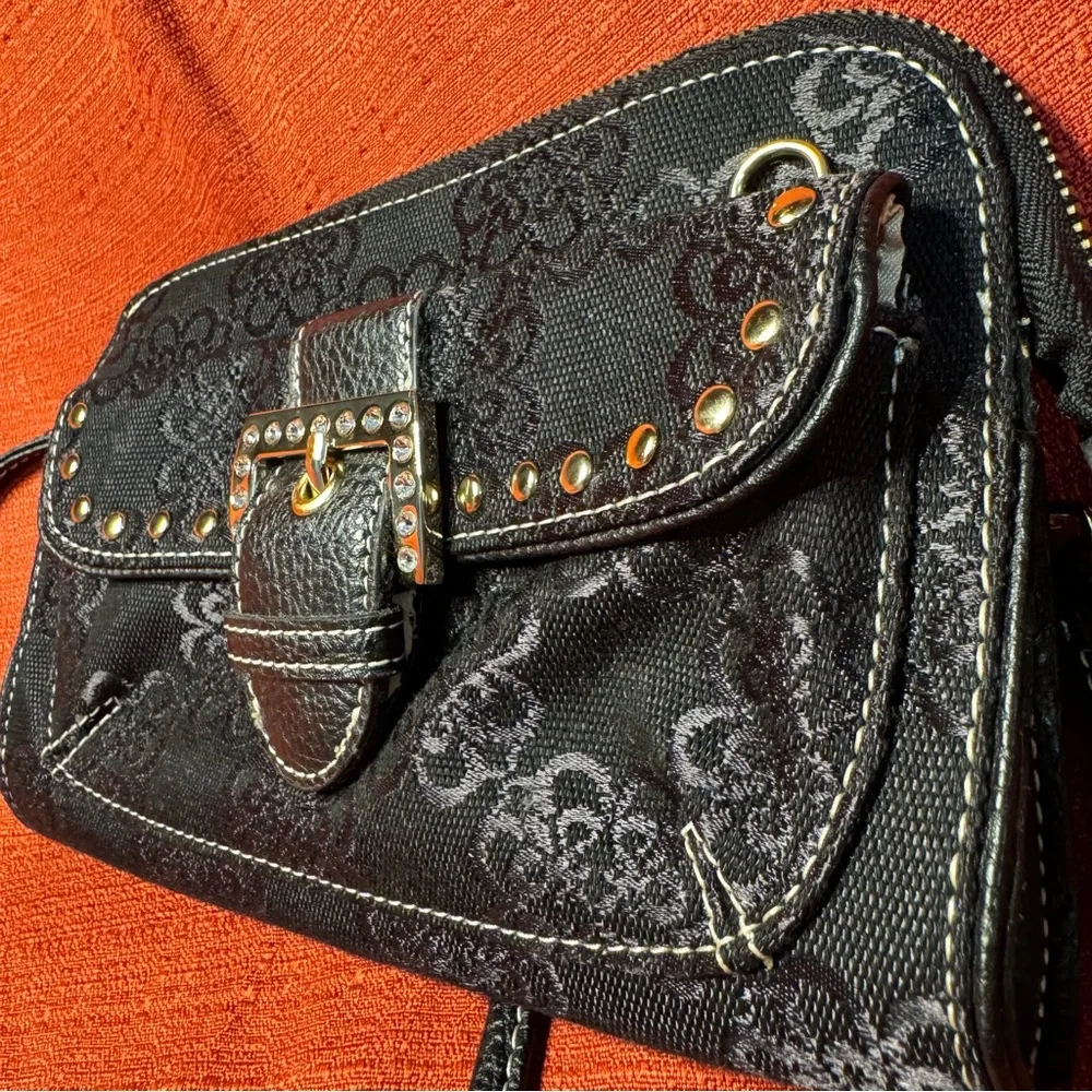Kathy Van Zeeland Crossbody handbag with safety clasps and wristlet strap, EUC
